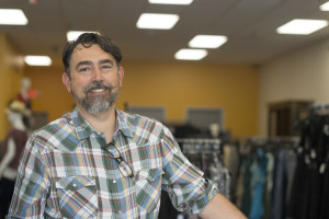Eric Smissen, visual specialist for Goodwill of Orange County, stands inside the Huntington Beach OC Goodwill Boutique. Smissen helped with the store's design, which is meant to feel more glamorous than a typical Goodwill.