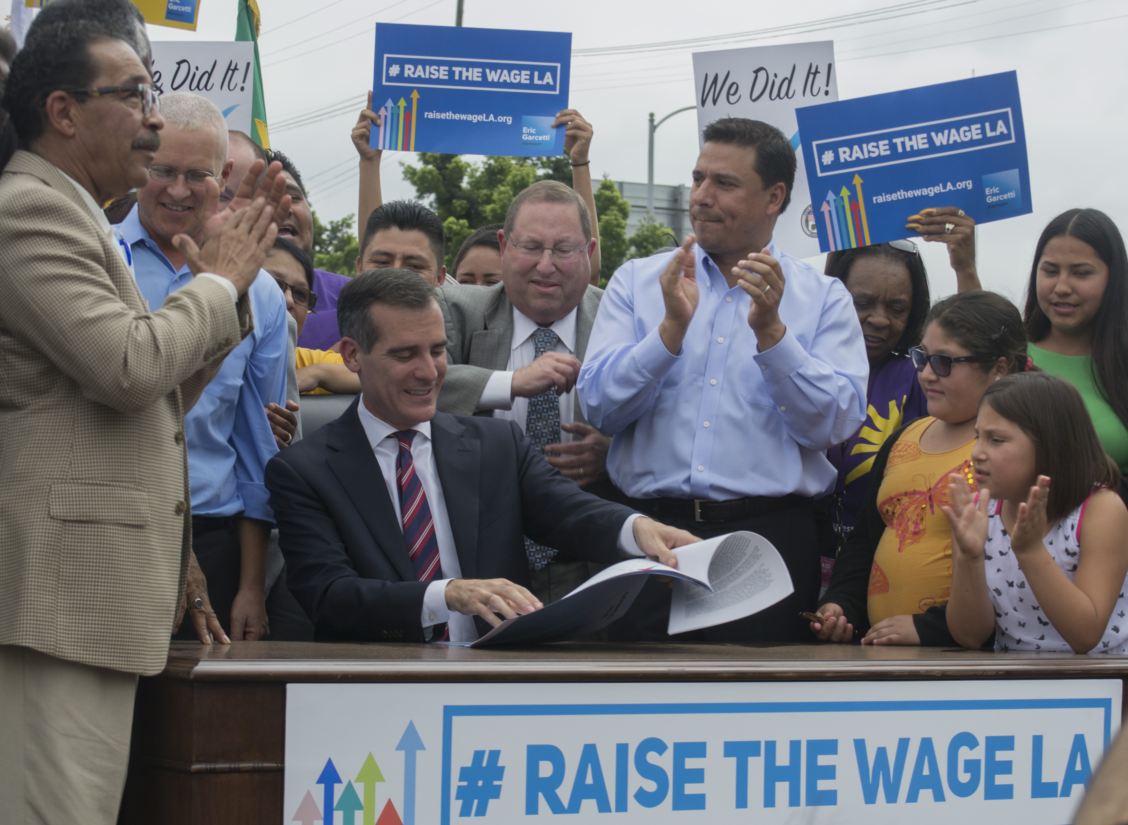 REUTERS: Los Angeles mayor signs $15/hour minimum wage hike into law